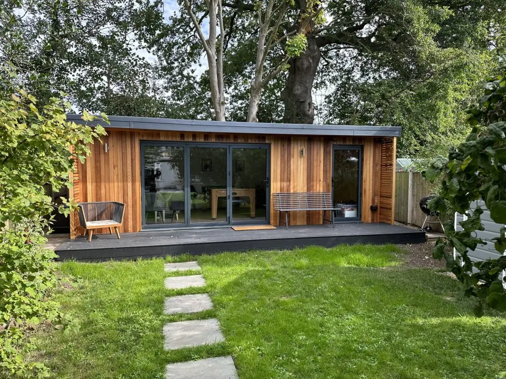 Garden games room in Watford with cedar cladding and deck